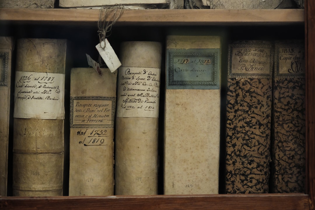 a-book-shelf-filled-with-lots-of-old-books-bcrnl6rim9i